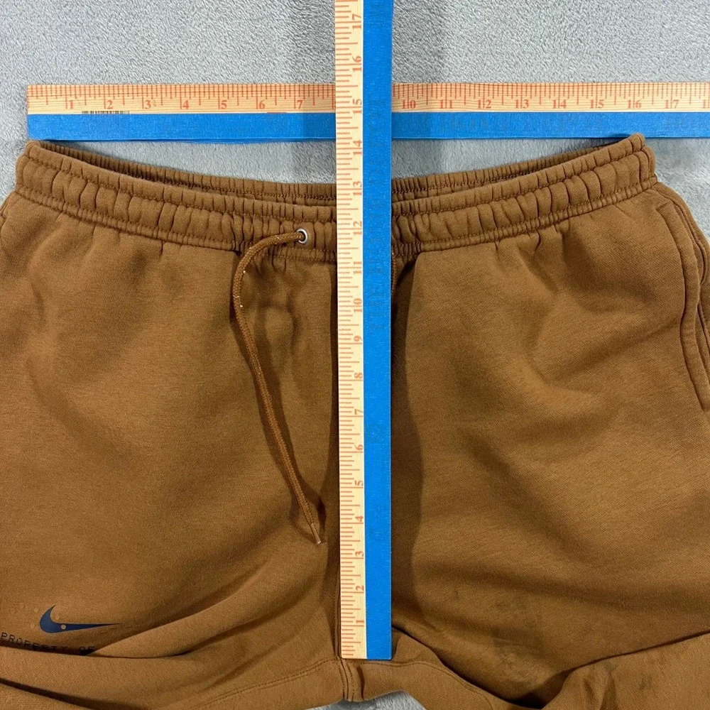 NIKE‎ Sportswear Club Cuffed Fleece Pants Mens Large Brown IM7828-235 Graphic